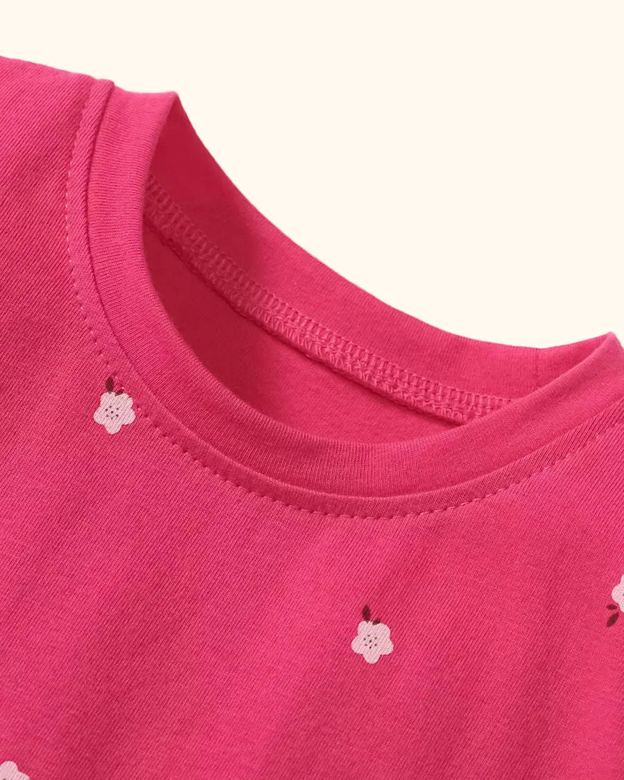 Hot pink kids floral print dress with round neckline, neckline close-up