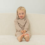 Taupe kids hooded jogger set with matching pants, seated front product