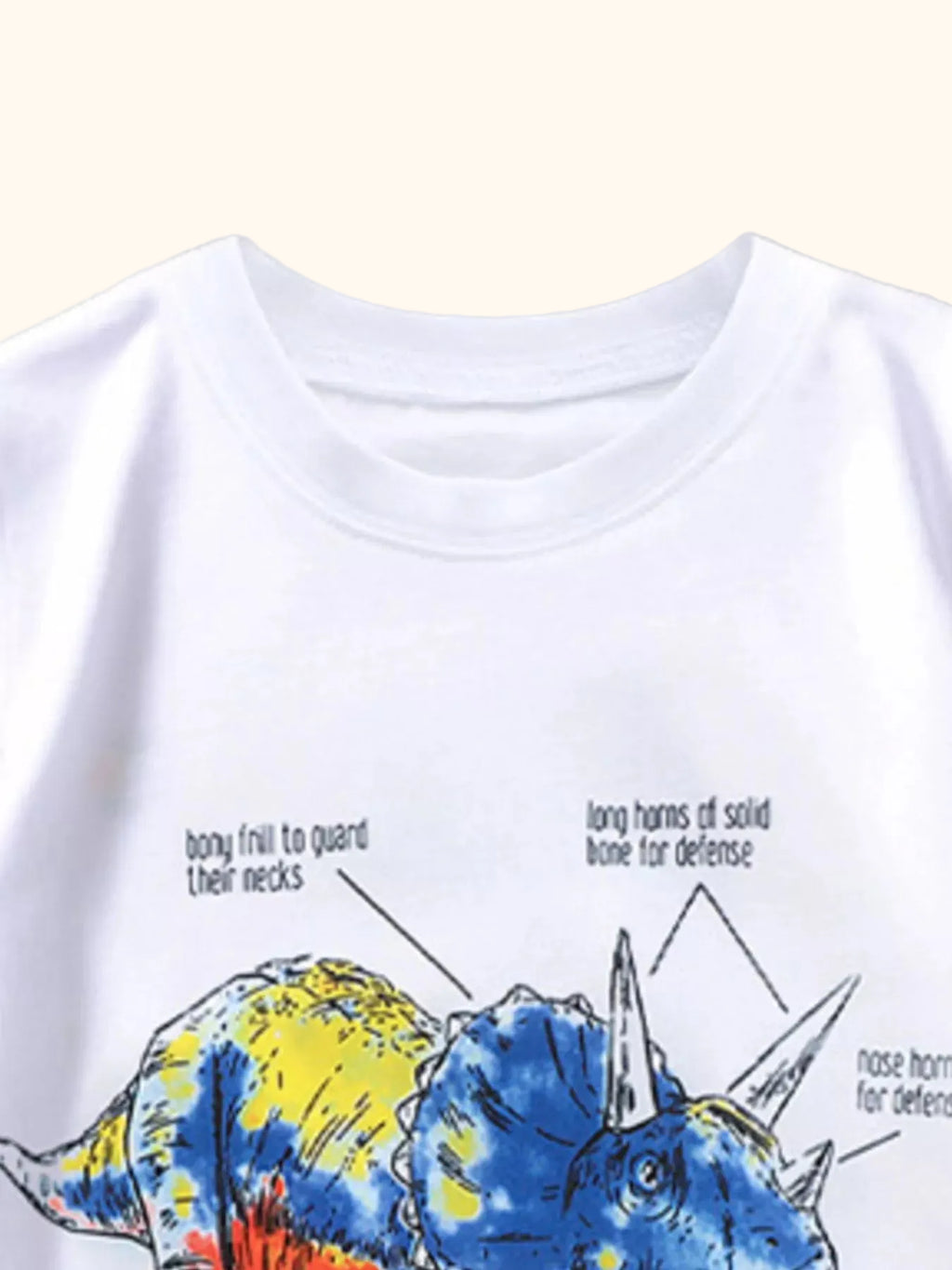 White kids Triceratops graphic T-shirt with round neckline, upper front close-up