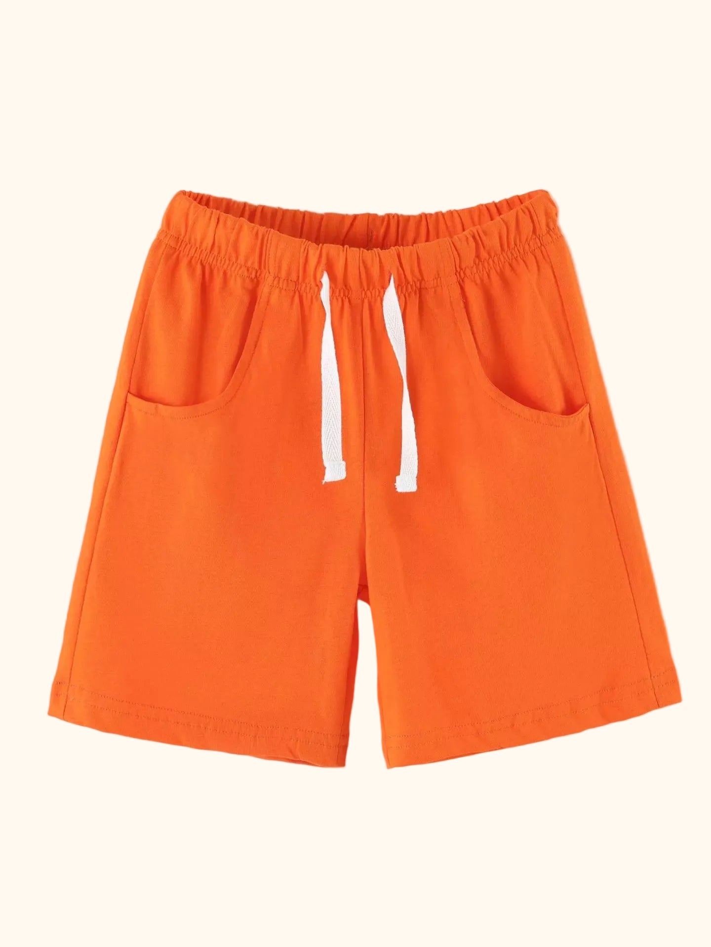 Orange kids shorts with side pockets and elastic drawstring waist, front product view