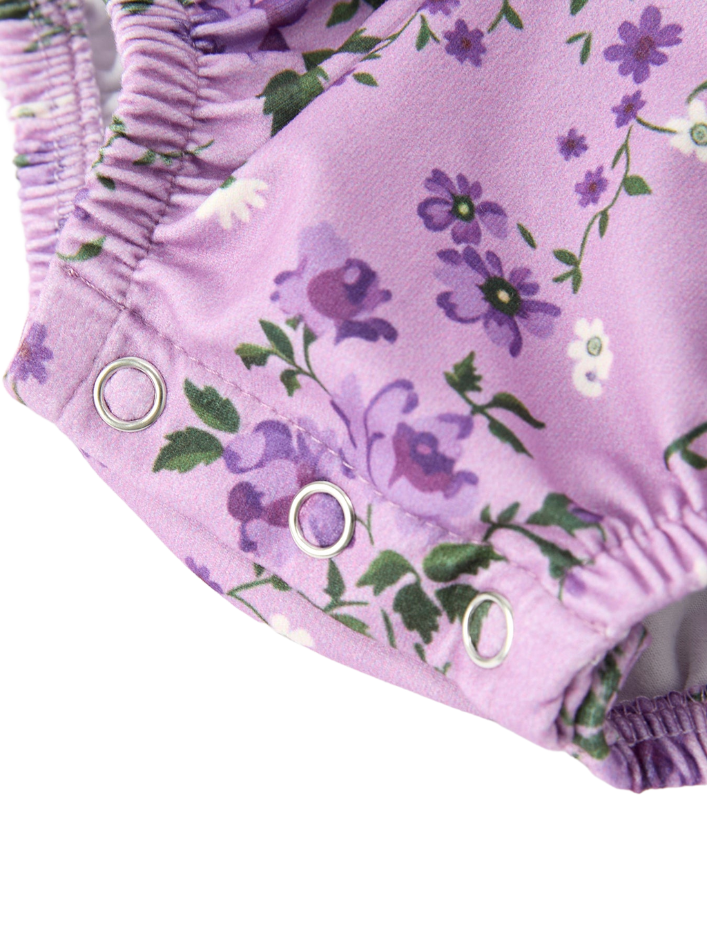 Lavender floral baby romper with three-snap crotch closure and elastic leg opening, detail view