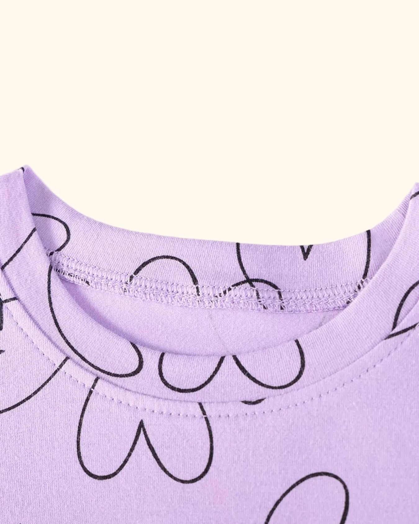 Lavender kids heart print dress with round neckline, neckline close-up