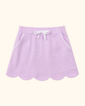 Lavender kids skort with scalloped hem, white bow and piped front pockets, front view