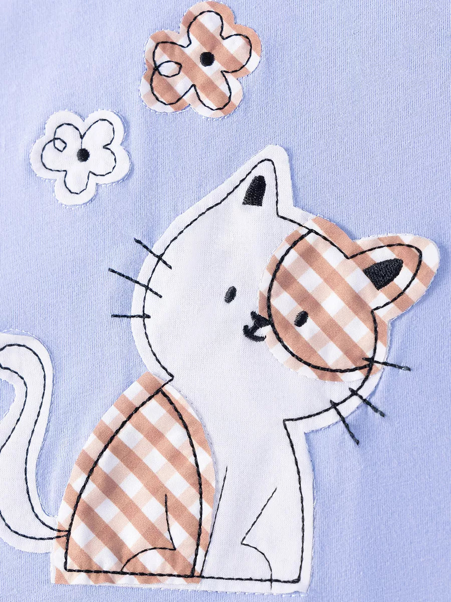 Light blue kids T-shirt with gingham cat appliqué and flower details, design close-up