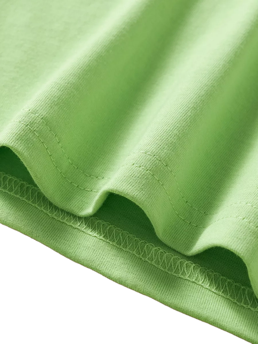 Light green kids Dino Island T-shirt with finished hem and cotton-blend texture, fabric close-up