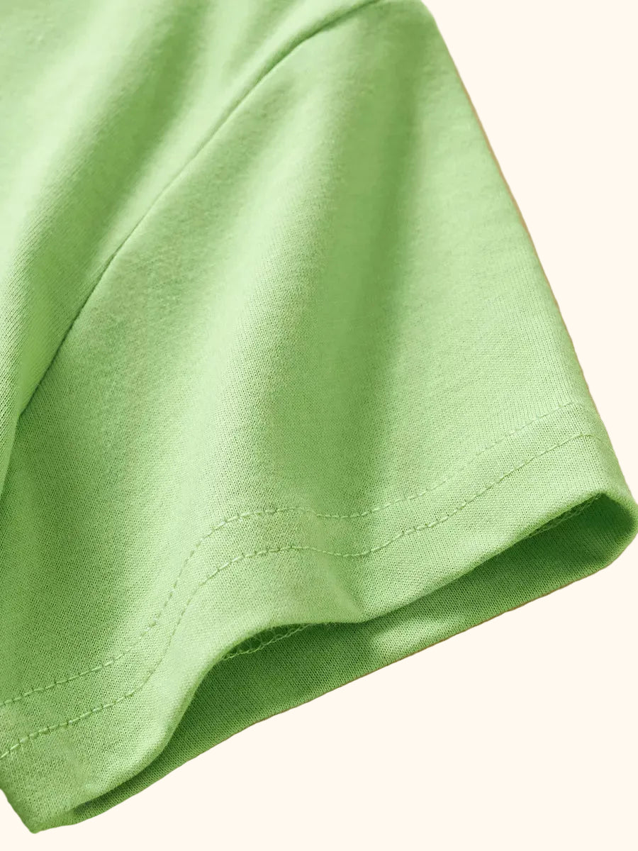 Light green kids Dino Island T-shirt with short sleeve stitching, sleeve detail view