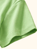 Light green kids Dino Island T-shirt with short sleeve stitching, sleeve detail view