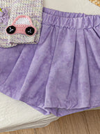 Light purple baby pull-on shorts with elastic waistband and subtle tonal pattern, close-up view