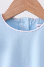 Mint kids flutter sleeve top with white-piped round neckline, neckline close-up