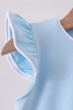 Mint kids top with white-trimmed flutter sleeve, sleeve detail close-up