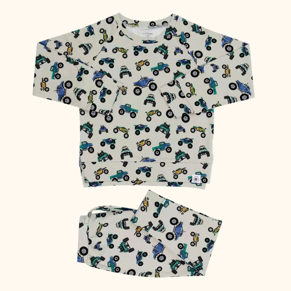 Ivory truck print crew neck pocket top and matching kids jogger pants, flat lay front view