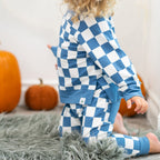 Moody blue checker kids jogger set with solid blue cuffs and pocket detail, side lifestyle view