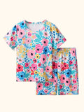 Multicolor kids floral print T-shirt and shorts set with pink, blue and yellow flowers, front product view
