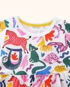 Multicolor kids animal print dress with round neckline and chest pocket, bodice close-up