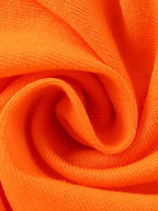 Orange kids dinosaur graphic T-shirt with cotton-blend knit texture, fabric close-up