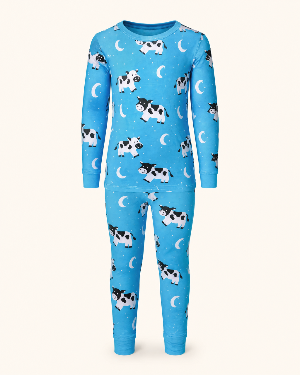 Bright blue kids cow and moon print bamboo pajama set with long sleeves and matching pants, front product view