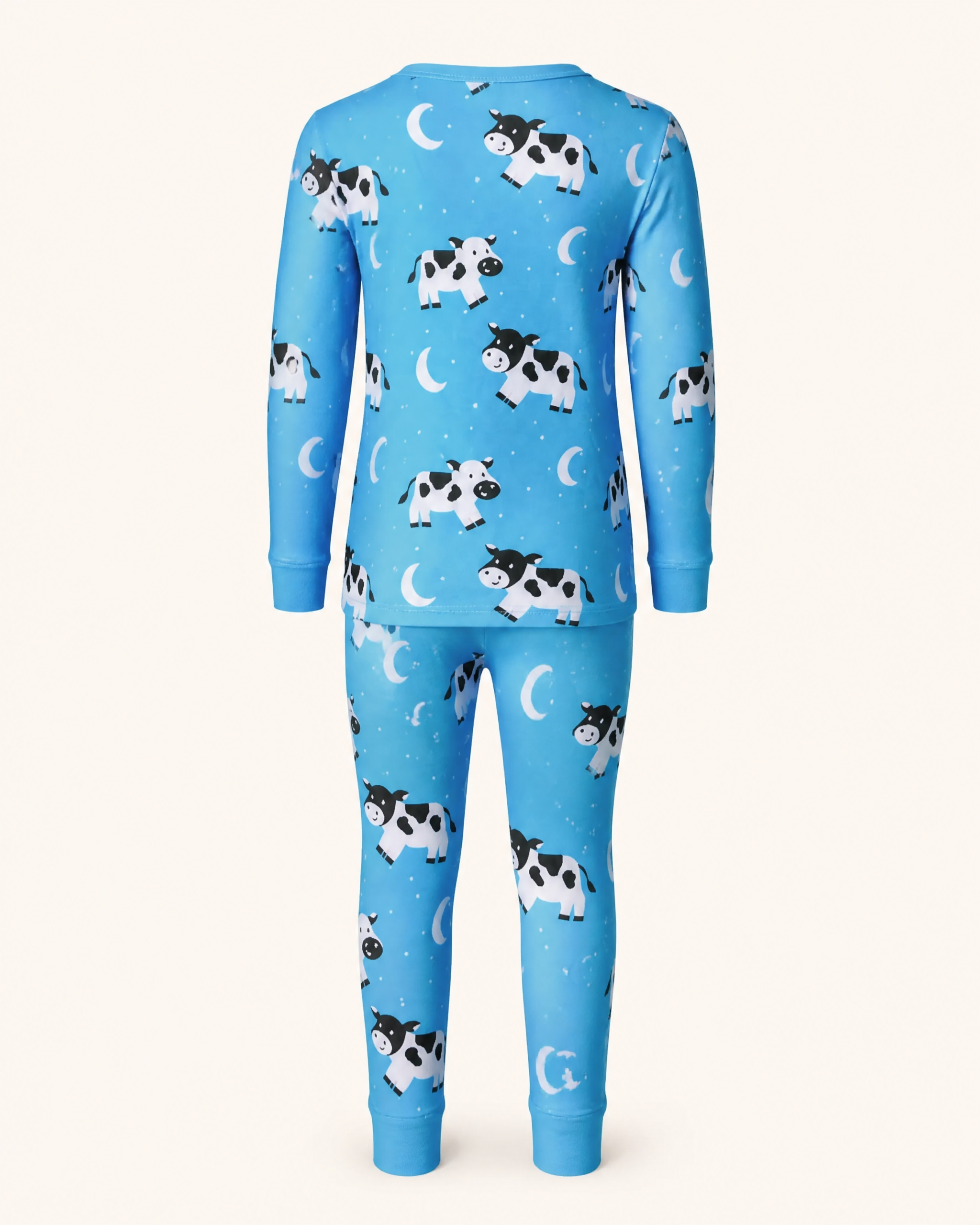 Bright blue kids cow print bamboo pajama set with crescent moons and cuffed pants, back product view