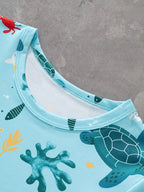 Pastel blue kids sea turtle print T-shirt with round neckline, neckline close-up