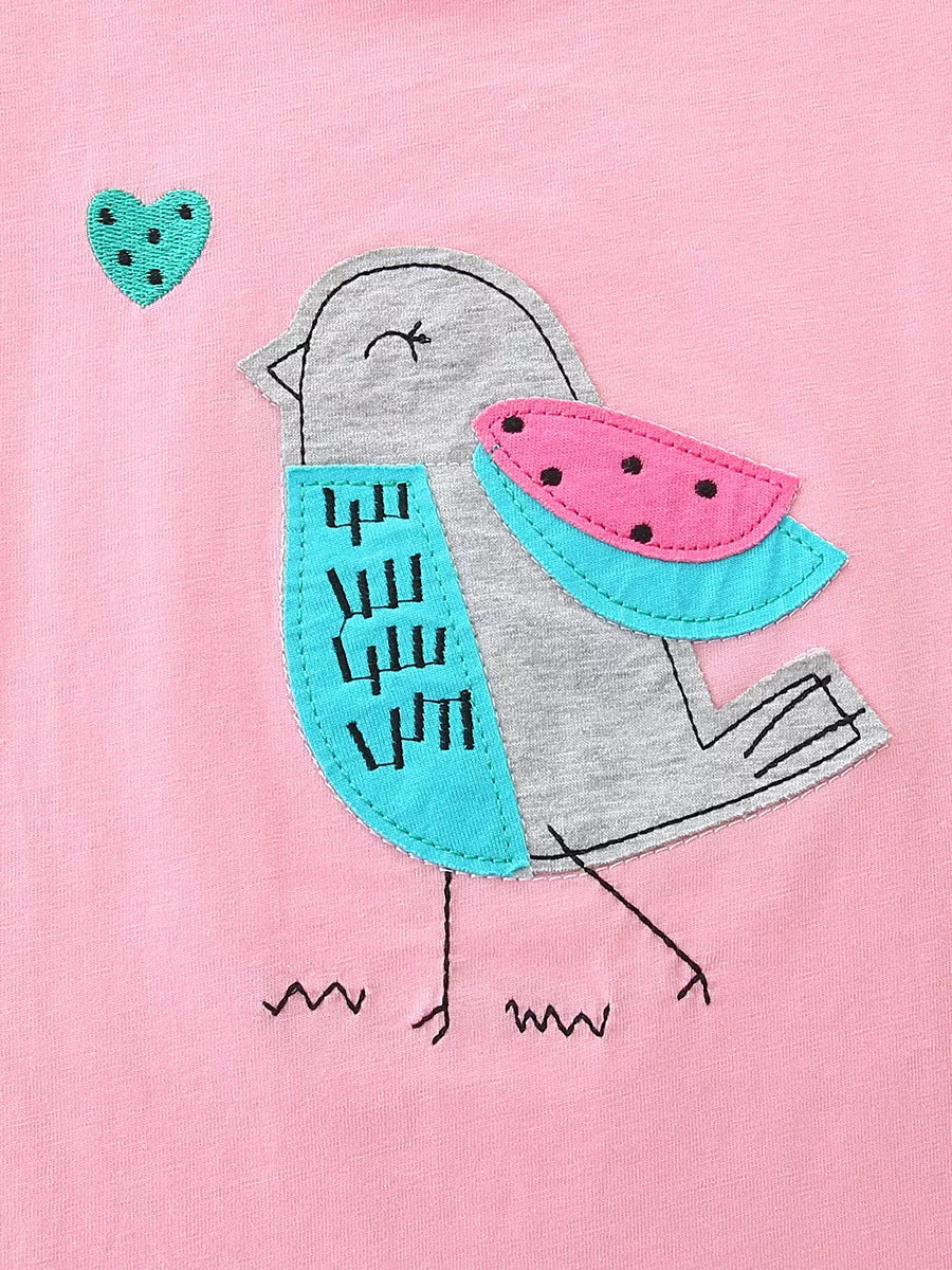 Pink kids top with gray and turquoise bird appliqué and heart detail, front detail view