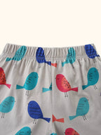 Light gray kids bird print shorts with turquoise, blue, and pink birds, waistband close-up