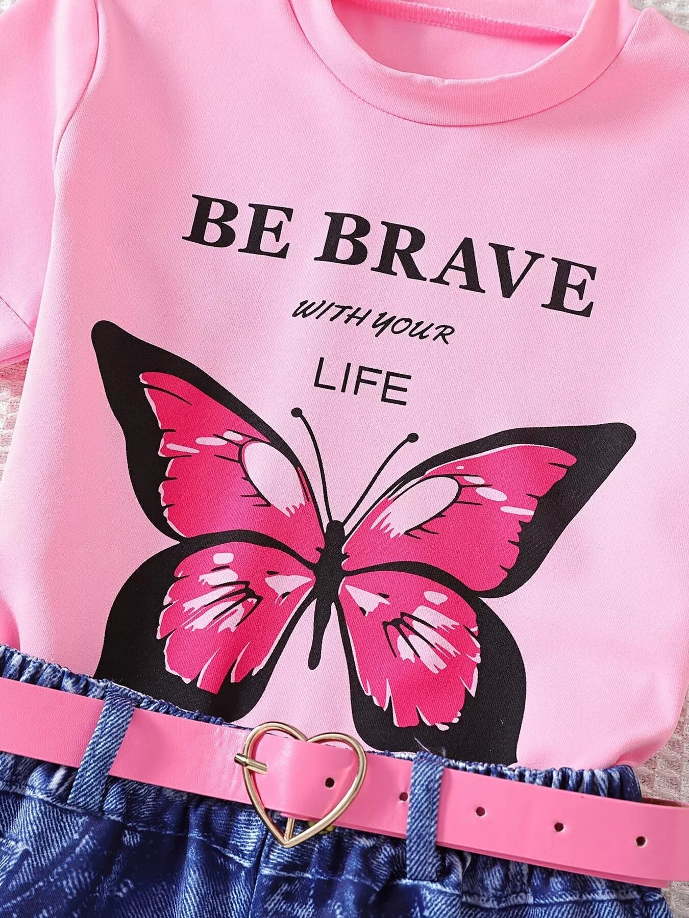 Pink butterfly graphic tee and coordinating shorts, full outfit view