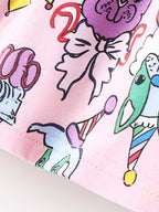 Pink kids animal print dress with colorful cartoon character details, fabric close-up