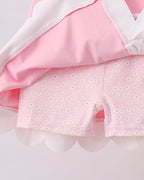 Pink kids active skort with daisy-print built-in shorts, underside detail view