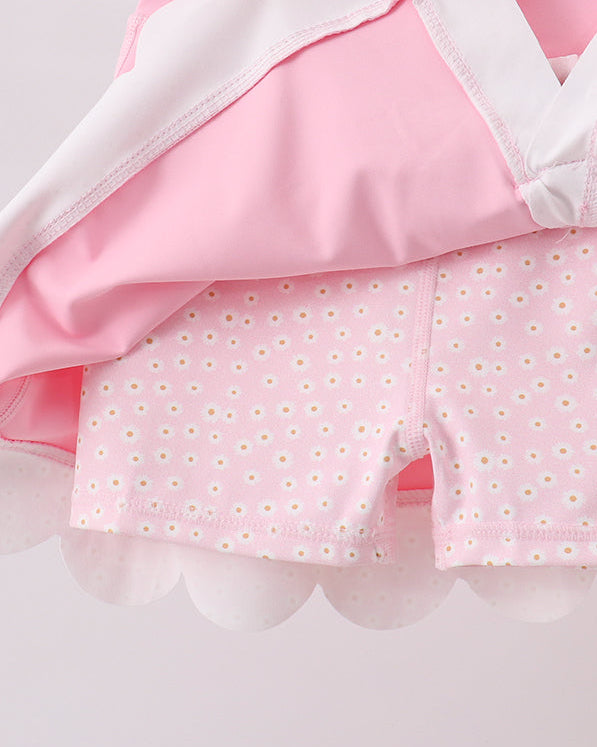 Pink kids active skort with daisy-print built-in shorts, underside detail view