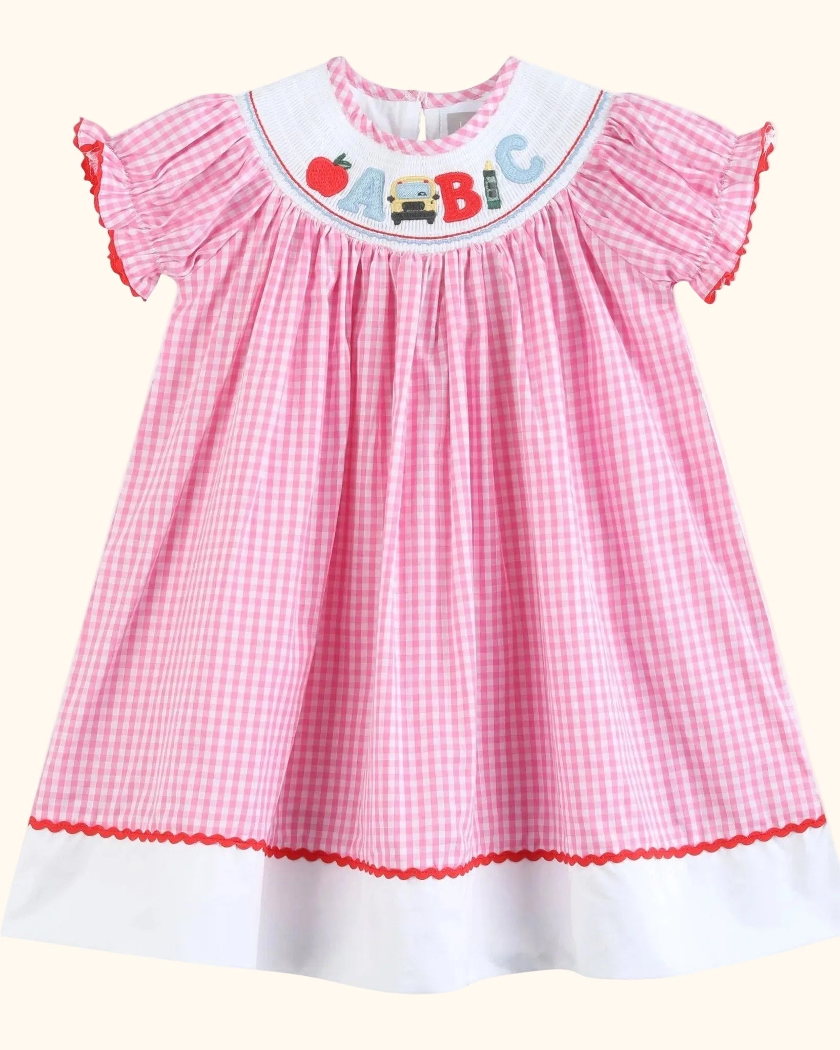 Pink gingham ABC school dress with white contrast hem band, full front view
