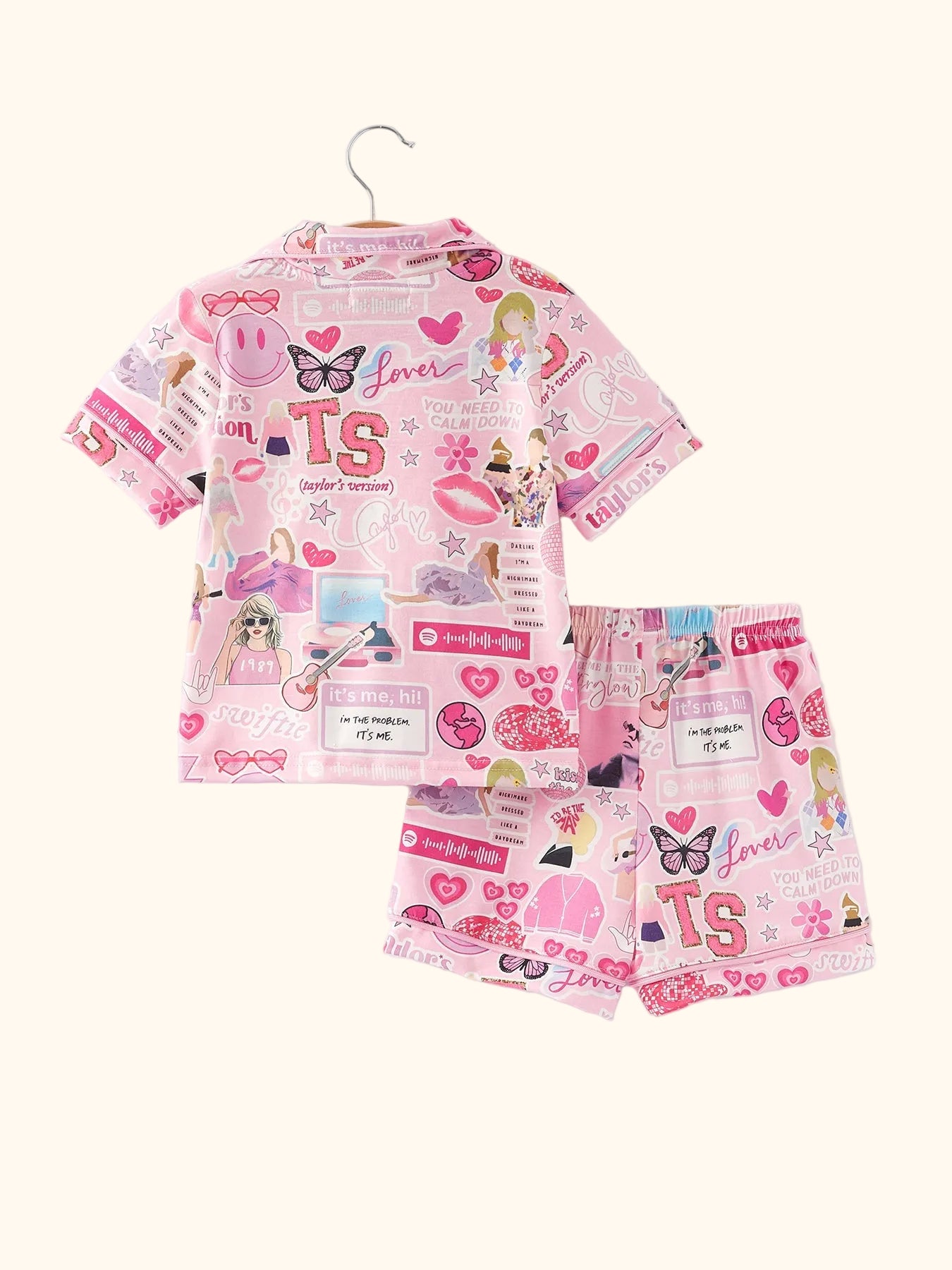 Pink kids music collage button-up pajama top and shorts set, back hanging view