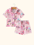 Pink kids music collage button-up pajama top and shorts set, front hanging view