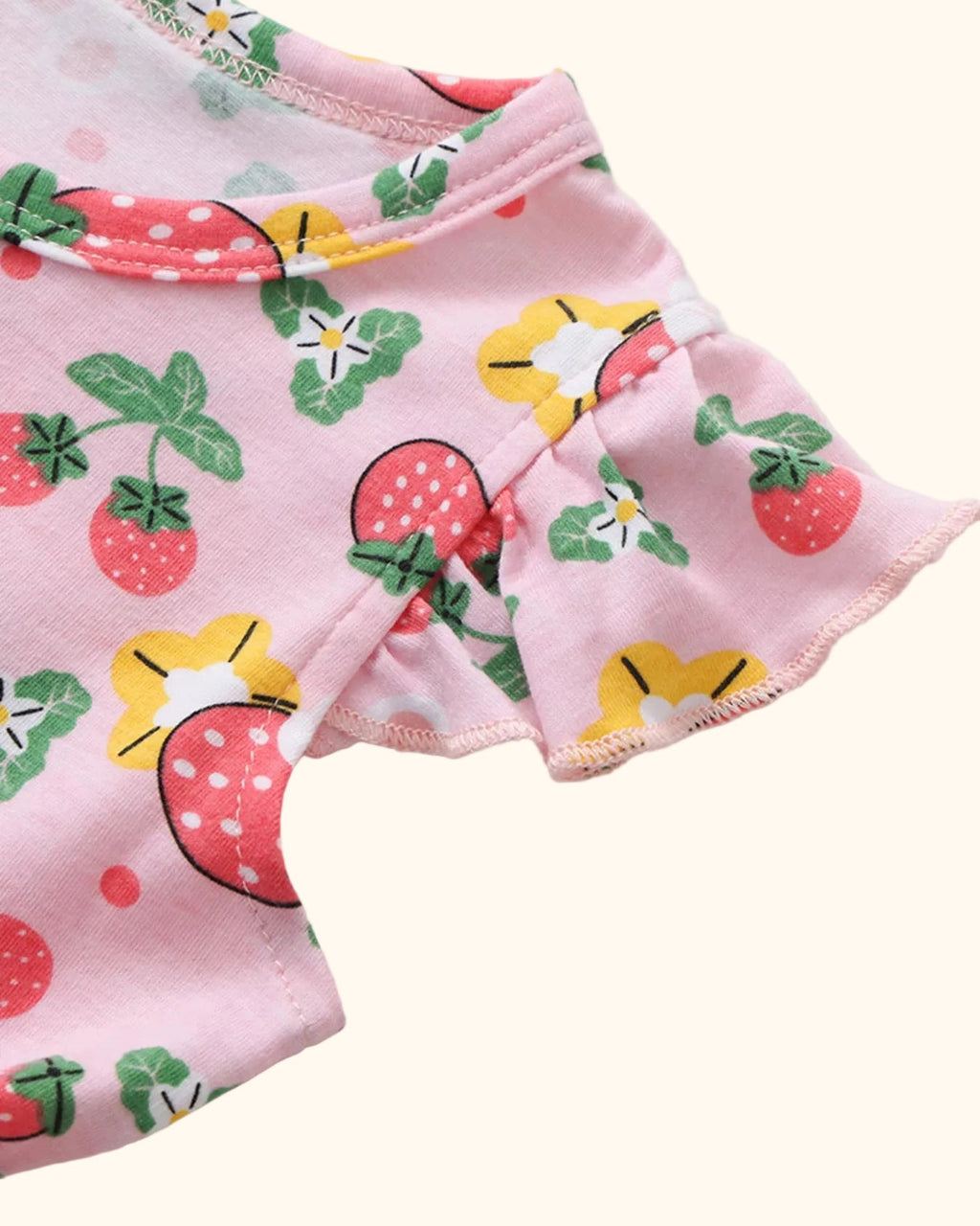 Pink kids strawberry print dress with flutter ruffle sleeve and round neckline, sleeve close-up
