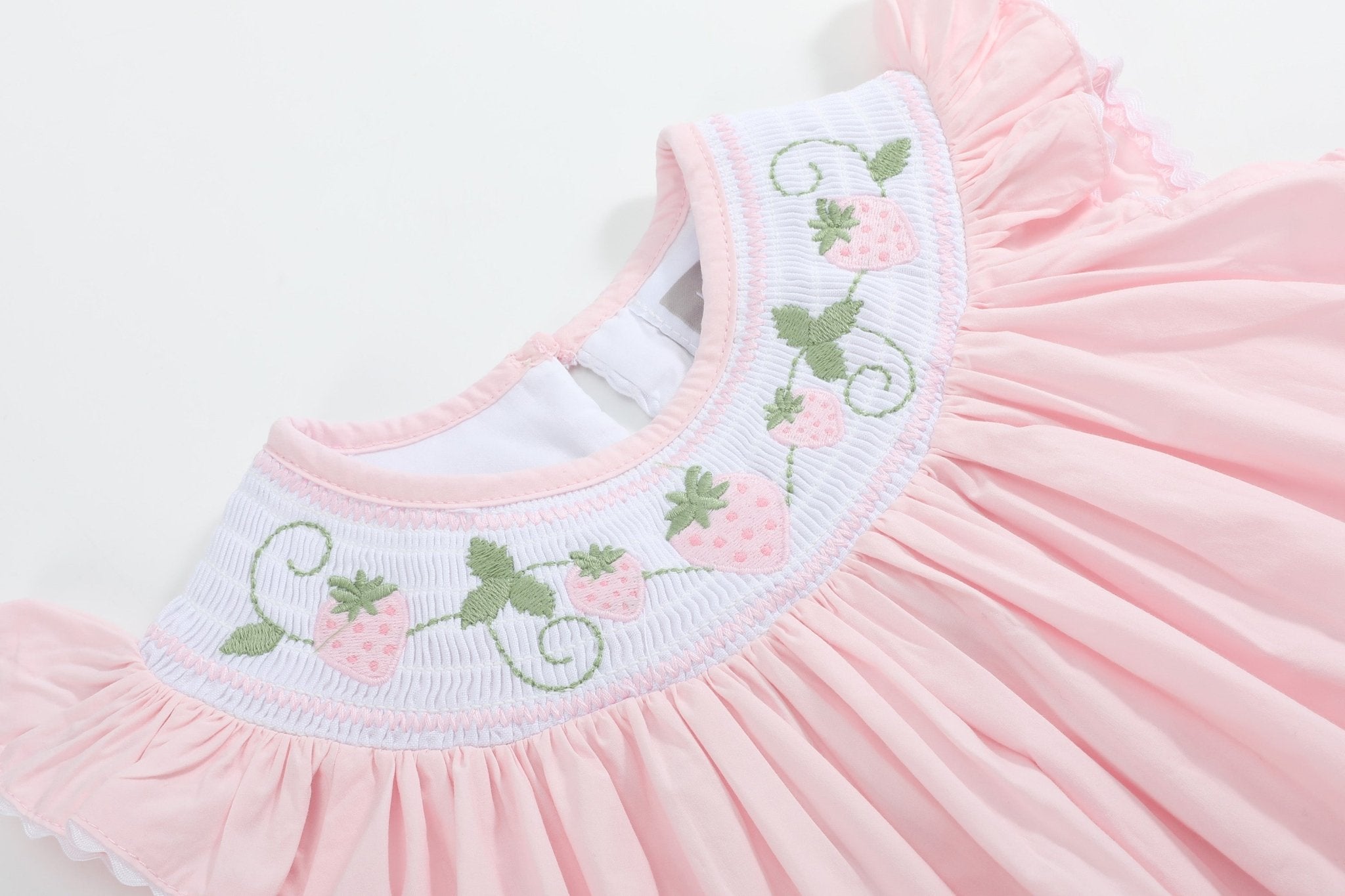 Pink strawberry vine smocked bishop dress with embroidered neckline, yoke close-up