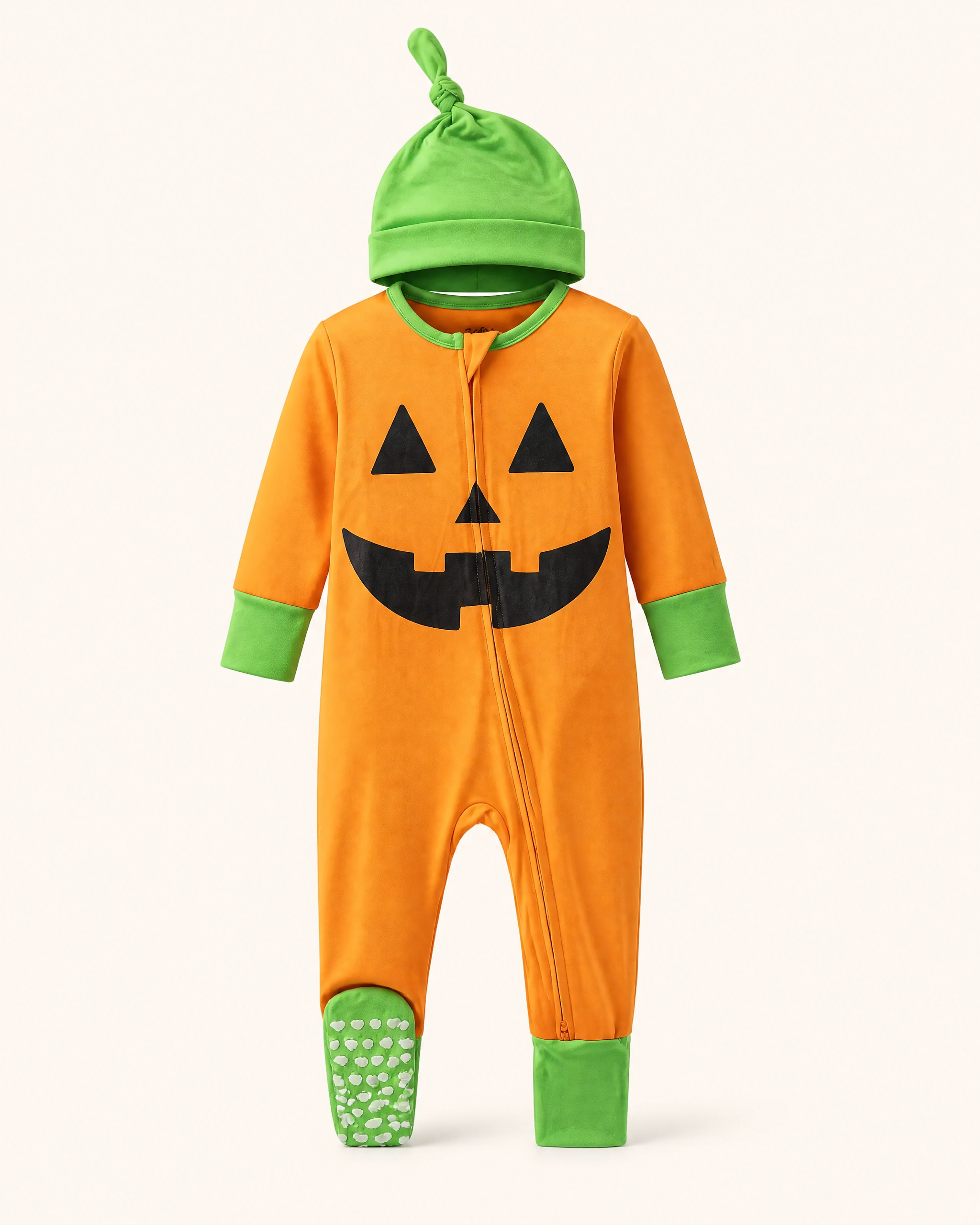 Orange baby pumpkin bamboo pajama costume with green knotted hat and grippy feet, front product view