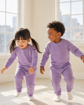 Purple kids crew neck jogger set with matching pants, front lifestyle view