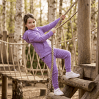 Purple kids hooded jogger set with kangaroo pocket and matching pants, playground lifestyle view