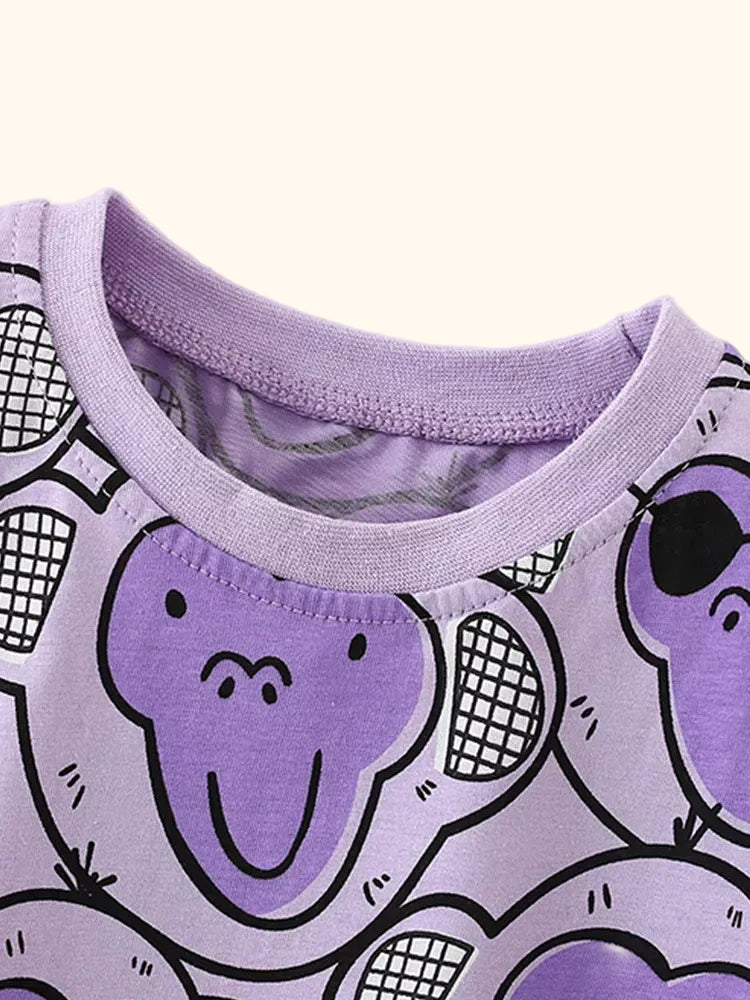 Purple kids monkey print T-shirt with lavender round neckline, neckline close-up