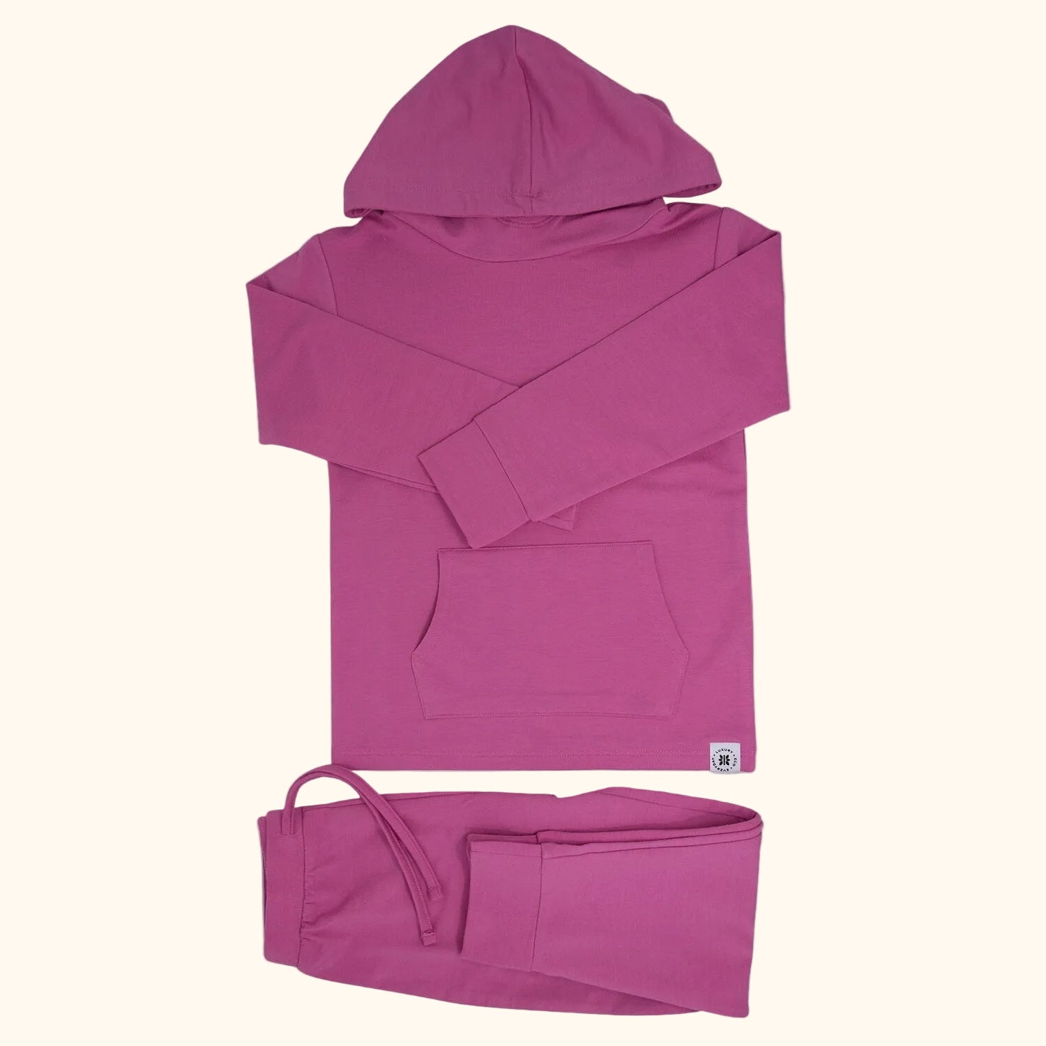 Raspberry rose hooded top and matching cuffed jogger pants with drawstring waist, flat lay view