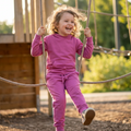 Raspberry rose kids hooded jogger set with kangaroo pocket and matching pants, playground front view