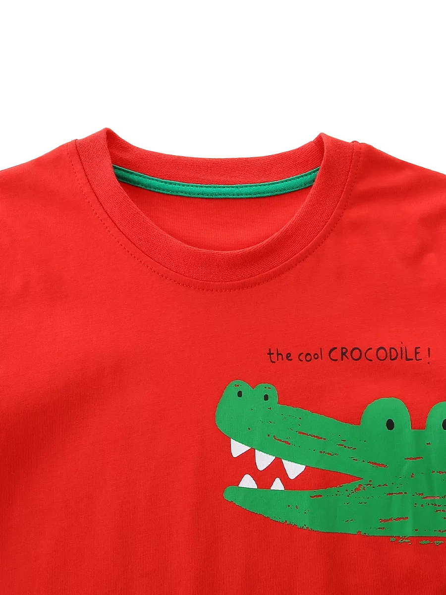 Red kids T-shirt with green crocodile graphic and round neckline, front close-up view