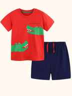 Red kids crocodile graphic T-shirt and navy shorts set, front product view