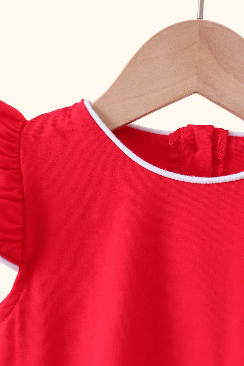 Red kids top with white-trim round neckline, close-up detail view