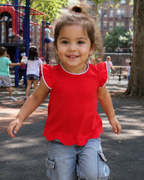 Red kids flutter-sleeve top with white trim, playground lifestyle view