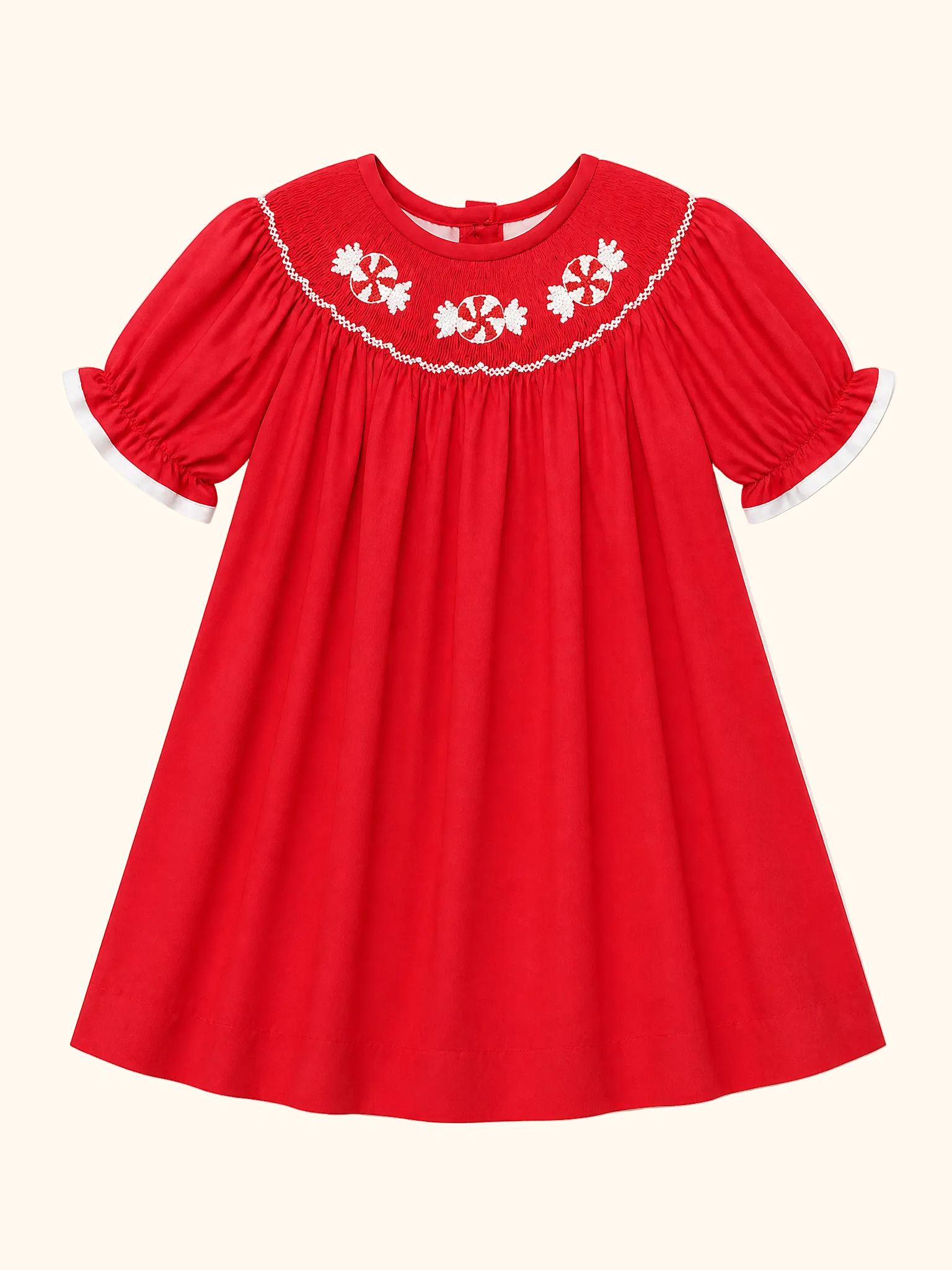 Red peppermint hand-smocked puff sleeve dress with white trim, front product view