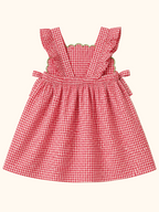 Red gingham watermelon ruffle dress with side ties and elasticized back, rear product view