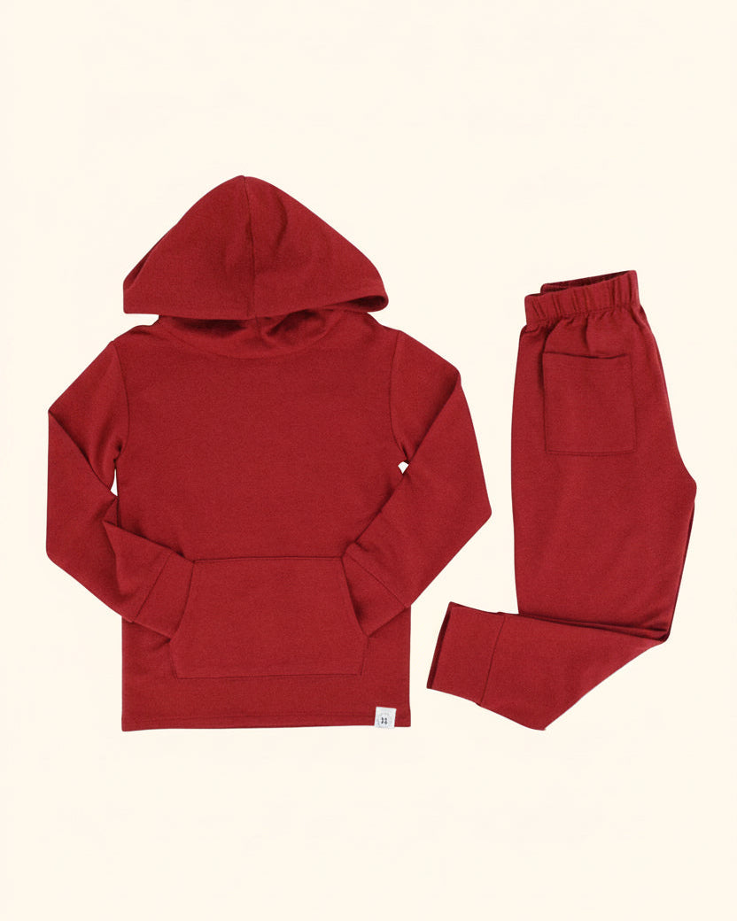 Rhubarb red hooded top with kangaroo pocket and matching kids jogger pants, flat lay product view