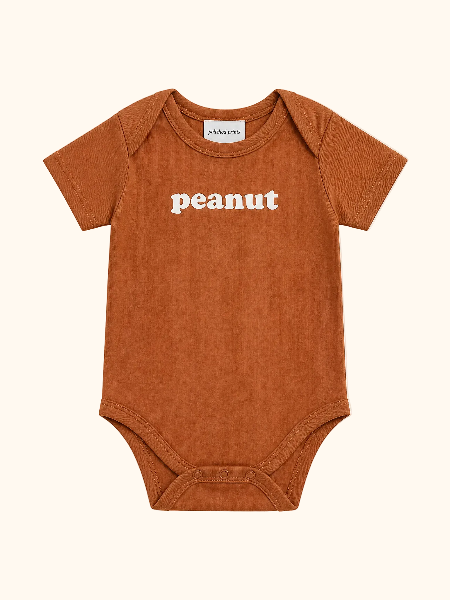 Rust brown baby organic cotton bodysuit with white peanut graphic and envelope neckline, front product view
