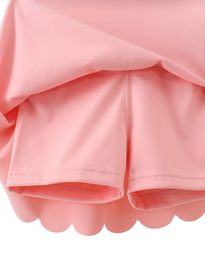 Pink active skort with built-in shorts, underside detail view