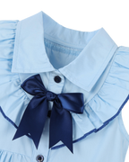 Sky blue kids dress with pointed collar, navy bow and ruffled shoulder trim, neckline close-up