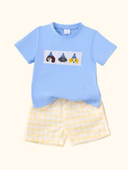 Sky blue baby puppy tee and yellow gingham shorts set with embroidered dog patch, front product view